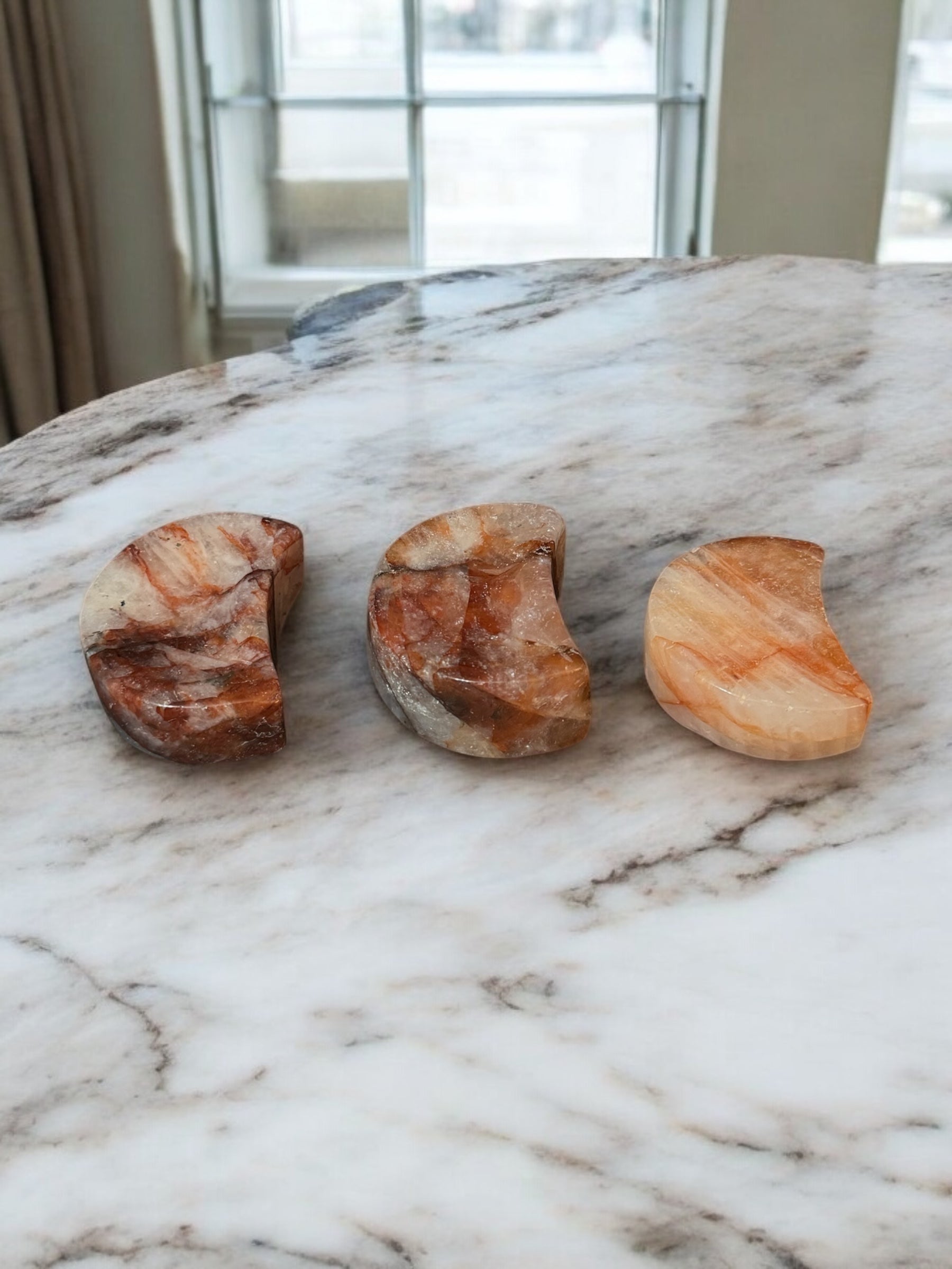 Fire Quartz Moon Bowl, a vibrant crystal bowl in fiery orange and red hues, perfect for crystal healing, energy work, and unique spiritual home decor.
