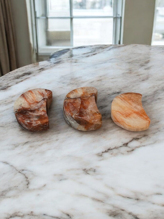 Fire Quartz Moon Bowl, a vibrant crystal bowl in fiery orange and red hues, perfect for crystal healing, energy work, and unique spiritual home decor.